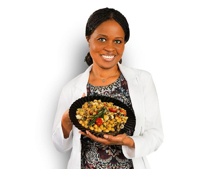 woman-holding-food-on-black-dish