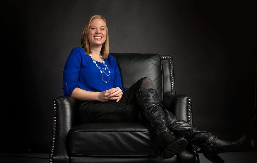 woman-sitting-on-black-leather-chair